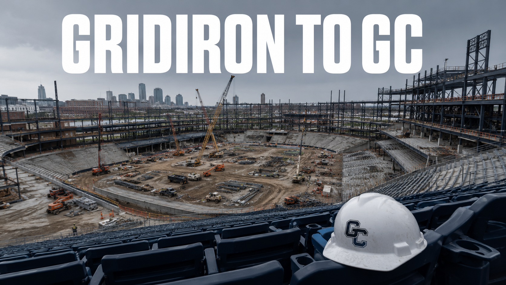 A half-built stadium with exposed steel and a hard hat resting on a seat in the foreground.